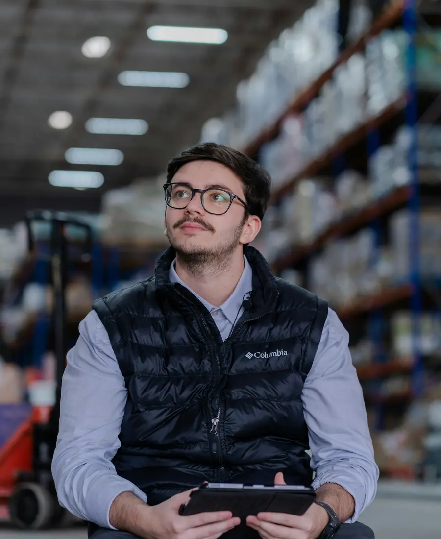 Warehouse employee checking goods with a tablet