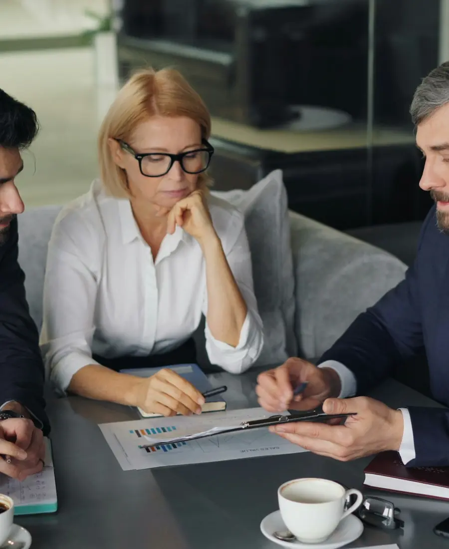A consultant in a working meeting with company managers