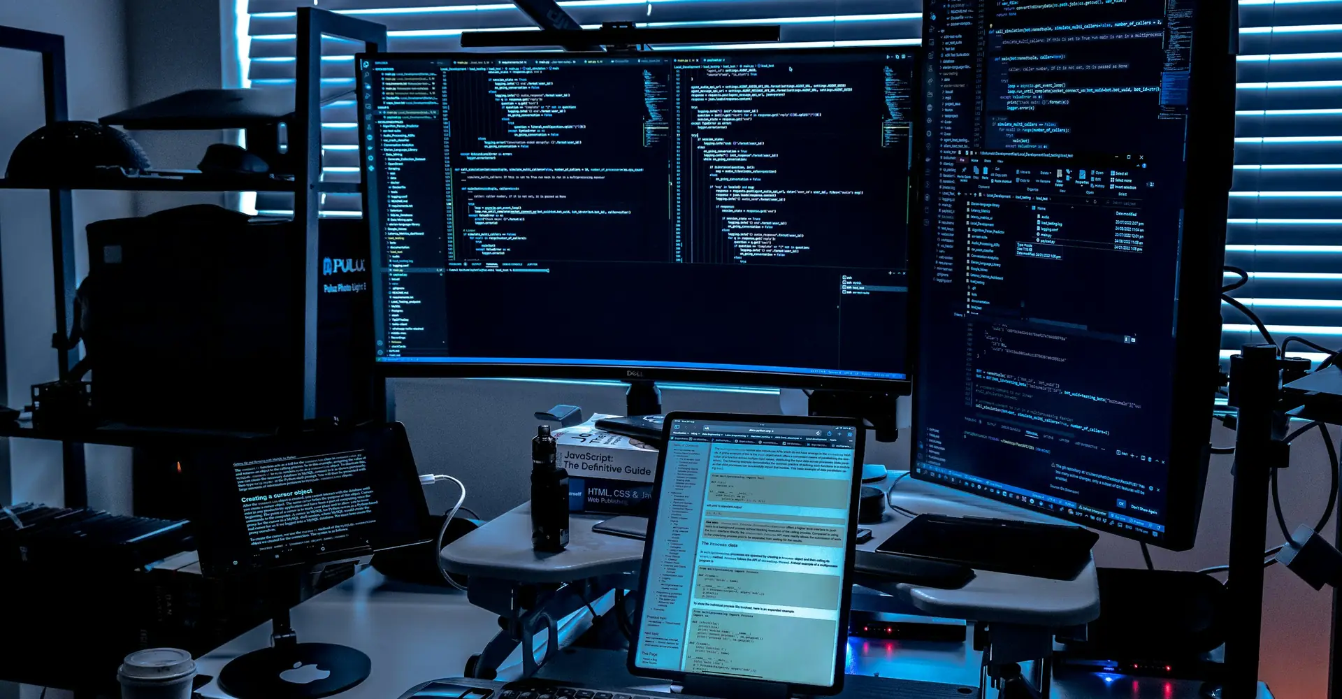 Workstation with several monitors in an IT department