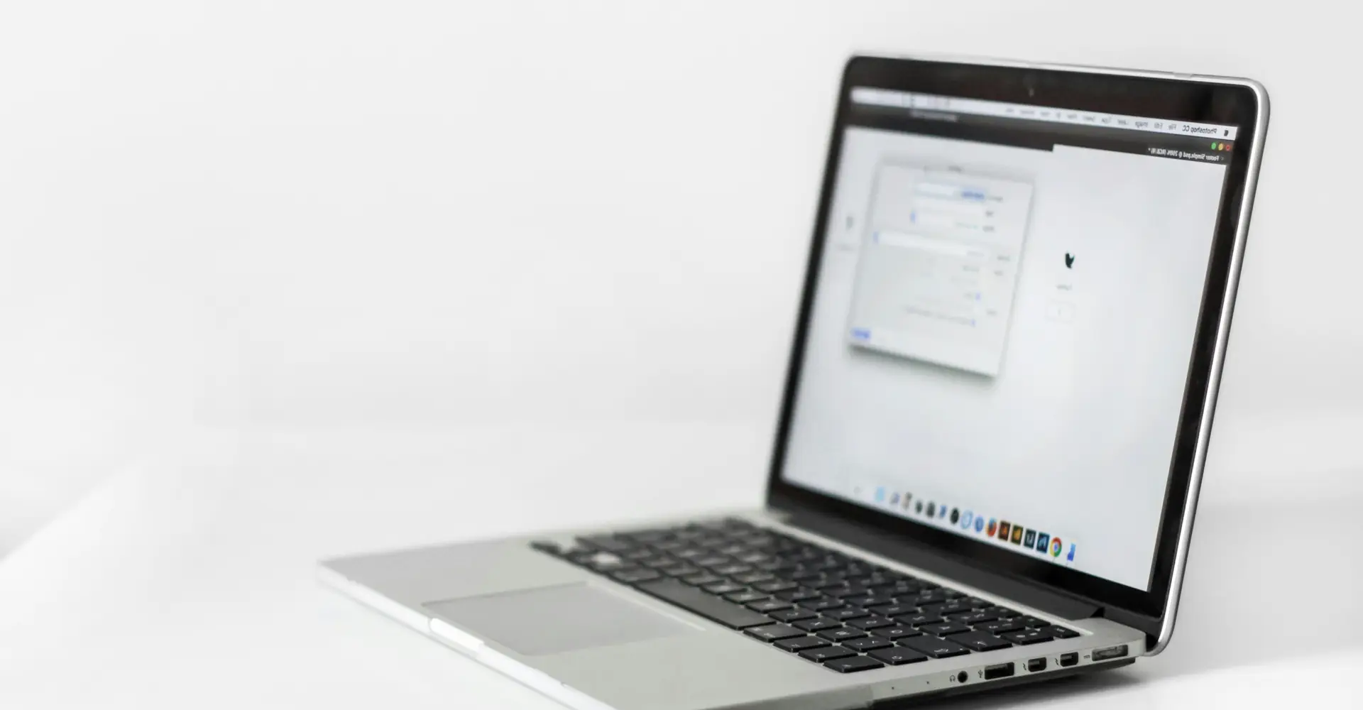 Open laptop on a white table